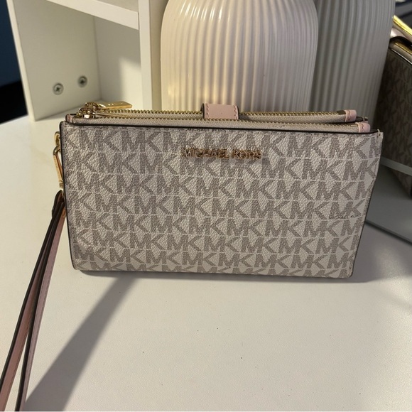 Michael Kors Handbags - Michael Kors Blush and Gray Monogram Wristlet